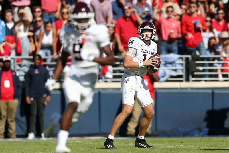 Nov 4, 2023; Oxford, Mississippi, USA; Texas A&M Aggies quarterback Max Johnson (14) looks for an open receiver during the second half against the Mississippi Rebels at Vaught-Hemingway Stadium. Mandatory Credit: Petre Thomas-USA TODAY Sports