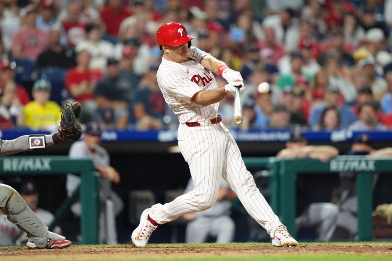 Jul 23, 2025; Philadelphia, Pennsylvania, USA; Philadelphia Phillies catcher J.T. Realmuto (10) hits a home run against the Boston Red Sox in the eighth inning at Citizens Bank Park. Mandatory Credit: Kyle Ross-Imagn Images