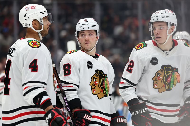 Mar 19, 2024; Los Angeles, California, USA;  Chicago Blackhawks defenseman Seth Jones (4) and center Ryan Donato (8) and defenseman Alex Vlasic (72) on the ice during the third period against the Los Angeles Kings at Crypto.com Arena. Mandatory Credit: Kiyoshi Mio-USA TODAY Sports