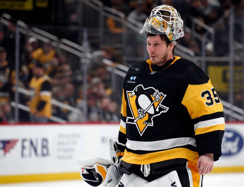 Jan 6, 2024; Pittsburgh, Pennsylvania, USA;  Pittsburgh Penguins goaltender Tristan Jarry (35) returns to his net during the second period against the Buffalo Sabres at PPG Paints Arena. Mandatory Credit: Charles LeClaire-USA TODAY Sports