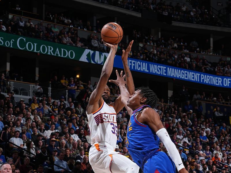 DENVER, CO - MARCH 5: Kevin Durant #35 of the Phoenix Suns shoots the ball during the game against the Denver Nuggets on March 5, 2024 at the Ball Arena in Denver, Colorado. NOTE TO USER: User expressly acknowledges and agrees that, by downloading and/or using this Photograph, user is consenting to the terms and conditions of the Getty Images License Agreement. Mandatory Copyright Notice: Copyright 2024 NBAE (Photo by Garrett Ellwood/NBAE via Getty Images)