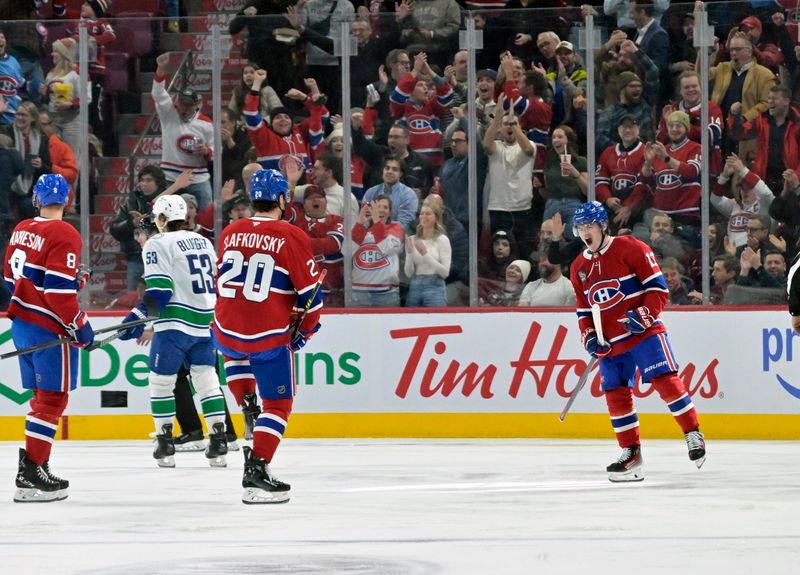 Jan 6, 2025; Montreal, Quebec, CAN; Montreal Canadiens forward Cole Caufield (13) celebrates after scoring a goal against the Vancouver Canucks during the first period at the Bell Centre. Mandatory Credit: Eric Bolte-Imagn Images