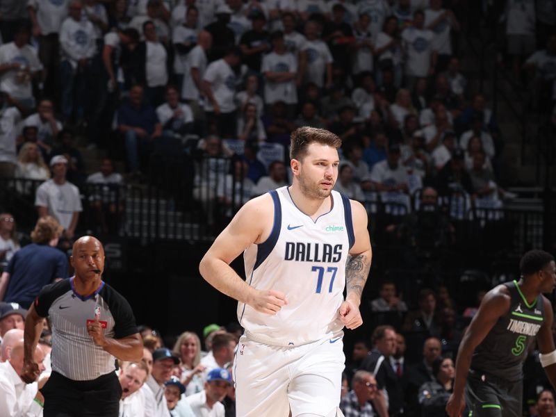 MINNEAPOLIS, MN - MAY 30: Luka Doncic #77 of the Dallas Mavericks looks on during the game against the Minnesota Timberwolves during Game 5 of the Western Conference Finals during the 2024 NBA Playoffs on May 30, 2024 at Target Center in Minneapolis, Minnesota. NOTE TO USER: User expressly acknowledges and agrees that, by downloading and or using this Photograph, user is consenting to the terms and conditions of the Getty Images License Agreement. Mandatory Copyright Notice: Copyright 2024 NBAE (Photo by David Sherman/NBAE via Getty Images)