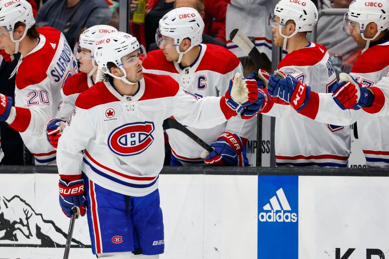 Mar 24, 2024; Seattle, Washington, USA; Montreal Canadiens center Alex Newhook (15) celebrates with teammates on the bench after scoring a goal against the Seattle Kraken during the first period at Climate Pledge Arena. Mandatory Credit: Joe Nicholson-USA TODAY Sports