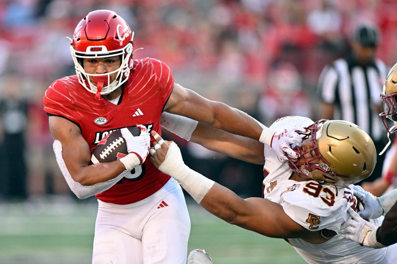 Sep 23, 2023; Louisville, Kentucky, USA;  Louisville Cardinals running back Isaac Guerendo (23) runs the ball against Boston College Eagles defensive tackle Owen Stoudmire (93) during the second half at L&N Federal Credit Union Stadium. Louisville defeated Boston College 56-28. Mandatory Credit: Jamie Rhodes-USA TODAY Sports