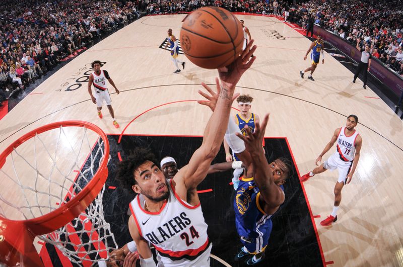 PORTLAND, OR - APRIL 11:  Justin Minaya #24 of the Portland Trail Blazers grabs the rebound during the game on April 11, 2024 at the Moda Center Arena in Portland, Oregon. NOTE TO USER: User expressly acknowledges and agrees that, by downloading and or using this photograph, user is consenting to the terms and conditions of the Getty Images License Agreement. Mandatory Copyright Notice: Copyright 2024 NBAE (Photo by Cameron Browne/NBAE via Getty Images)