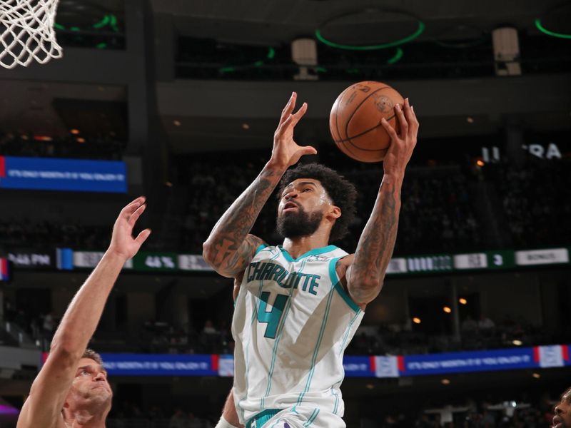 MILWAUKEE, WI - FEBRUARY 9: Nick Richards #4 of the Charlotte Hornets drives to the basket during the game against the Milwaukee Bucks on February 9, 2024 at the Fiserv Forum Center in Milwaukee, Wisconsin. NOTE TO USER: User expressly acknowledges and agrees that, by downloading and or using this Photograph, user is consenting to the terms and conditions of the Getty Images License Agreement. Mandatory Copyright Notice: Copyright 2024 NBAE (Photo by Gary Dineen/NBAE via Getty Images).