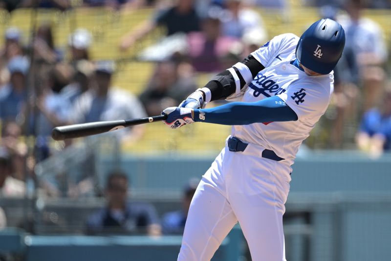 Apr 17, 2024; Los Angeles, California, USA; Los Angeles Dodgers designated hitter player Shohei Ohtani (17) singles in the first inning against the Washington Nationals at Dodger Stadium. Mandatory Credit: Jayne Kamin-Oncea-USA TODAY Sports