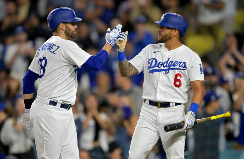 Jul 5, 2023; Los Angeles, California, USA; Los Angeles Dodgers designated hitter J.D. Martinez (28) is congratulated by left fielder David Peralta (6) after hitting a three-run home run in the fifth inning against the Pittsburgh Pirates at Dodger Stadium. Mandatory Credit: Jayne Kamin-Oncea-USA TODAY Sports