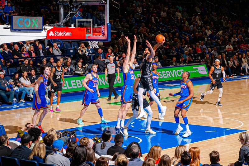 OKLAHOMA CITY, OK - APRIL 10:  Julian Champagnie #30 of the San Antonio Spurs drives to the basket during the game against the Oklahoma City Thunder on April 10, 2024 at Paycom Arena in Oklahoma City, Oklahoma. NOTE TO USER: User expressly acknowledges and agrees that, by downloading and or using this photograph, User is consenting to the terms and conditions of the Getty Images License Agreement. Mandatory Copyright Notice: Copyright 2024 NBAE (Photo by Zach Beeker/NBAE via Getty Images)