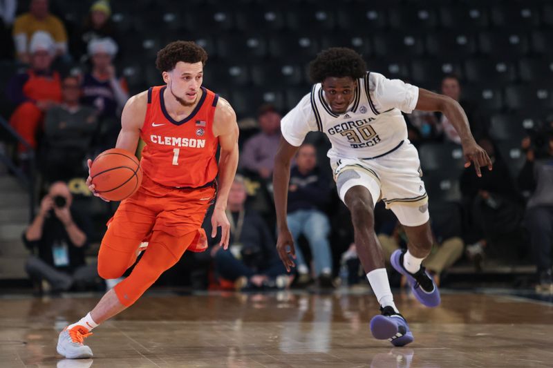 Jan 14, 2025; Atlanta, Georgia, USA; Clemson Tigers guard Chase Hunter (1) dribbles the ball down the court against Georgia Tech Yellow Jackets forward Ibrahim Souare (30) during the second half at McCamish Pavilion. Mandatory Credit: Jordan Godfree-Imagn Images