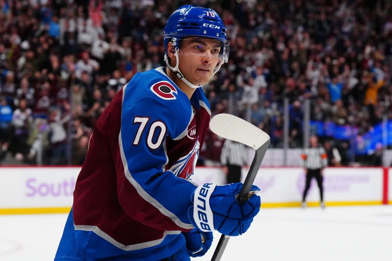 Nov 9, 2024; Denver, Colorado, USA; Colorado Avalanche defenseman Sam Malinski (70) celebrates his goal in the second period against the Carolina Hurricanes at Ball Arena. Mandatory Credit: Ron Chenoy-Imagn Images