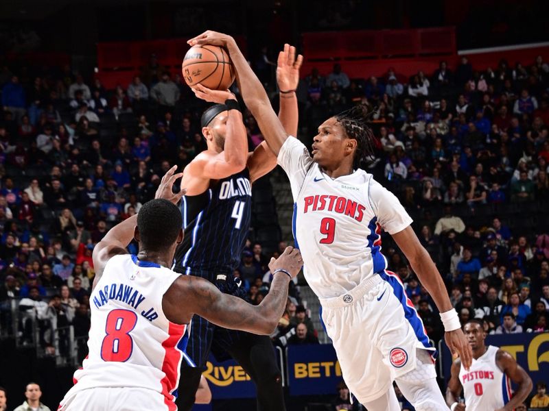 DETROIT, MI - JANUARY 1: Ausar Thompson #9 of the Detroit Pistons blocks shots during the game against the Orlando Magic on January 1, 2025 at Little Caesars Arena in Detroit, Michigan. NOTE TO USER: User expressly acknowledges and agrees that, by downloading and/or using this photograph, User is consenting to the terms and conditions of the Getty Images License Agreement. Mandatory Copyright Notice: Copyright 2025 NBAE (Photo by Chris Schwegler/NBAE via Getty Images)
