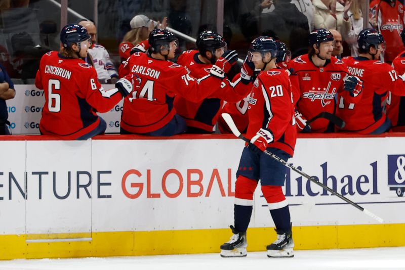 Jan 4, 2025; Washington, District of Columbia, USA; Washington Capitals center Lars Eller (20) celebrates with teammates after scoring a goal against the New York Rangers in the second period at Capital One Arena. Mandatory Credit: Geoff Burke-Imagn Images