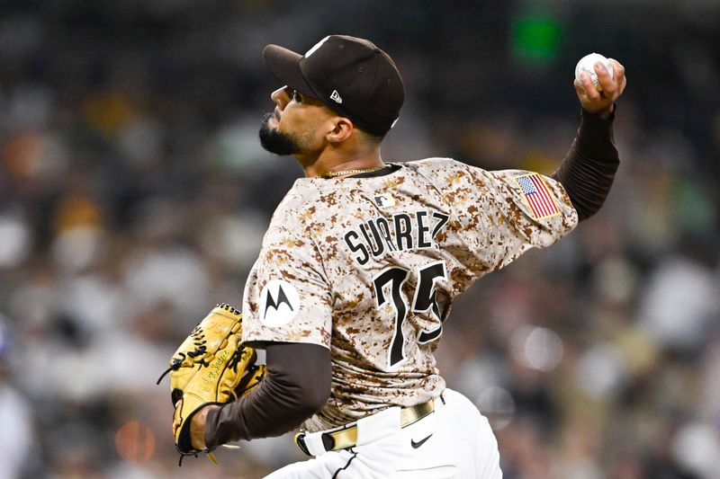 Jul 6, 2025; San Diego, California, USA; San Diego Padres relief pitcher Robert Suarez (75) delivers during the ninth inning against the Texas Rangers at Petco Park. Mandatory Credit: Denis Poroy-Imagn Images