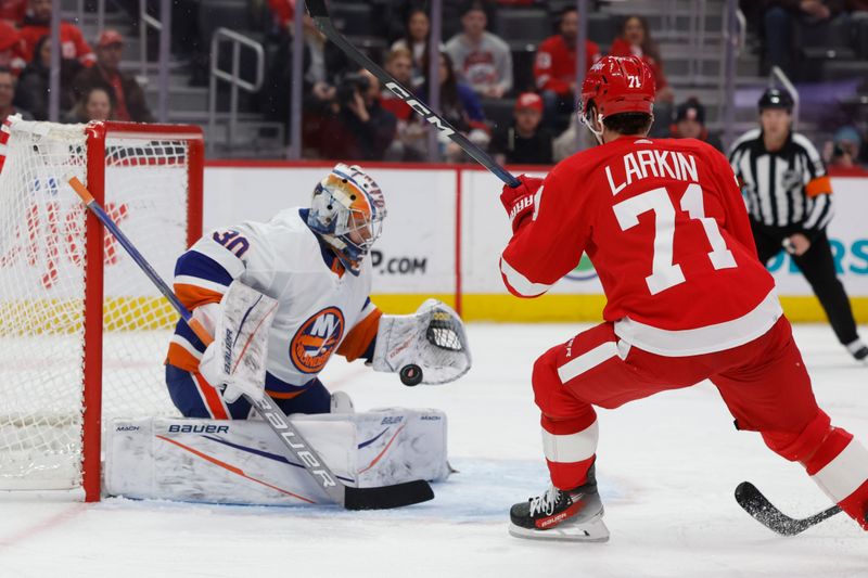 Feb 29, 2024; Detroit, Michigan, USA;  New York Islanders goaltender Ilya Sorokin (30) makes a save on Detroit Red Wings center Dylan Larkin (71) in the second period at Little Caesars Arena. Mandatory Credit: Rick Osentoski-USA TODAY Sports