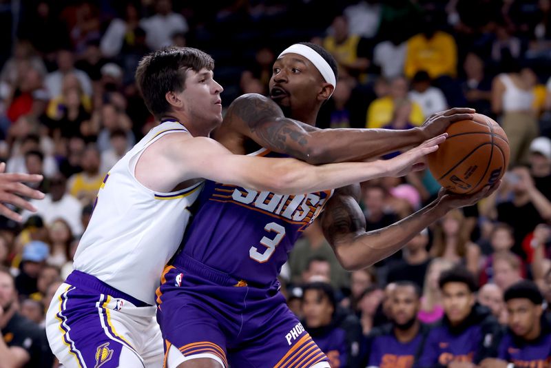 PALM SPRINGS, CALIFORNIA - OCTOBER 06: Bradley Beal #3 of the Phoenix Suns controls the ball against Austin Reaves #15 of the Los Angeles Lakers during the first quarter at Acrisure Arena on October 06, 2024 in Palm Springs, California. NOTE TO USER: User expressly acknowledges and agrees that, by downloading and/or using this photograph, user is consenting to the terms and conditions of the Getty Images License Agreement. (Photo by Katelyn Mulcahy/Getty Images)