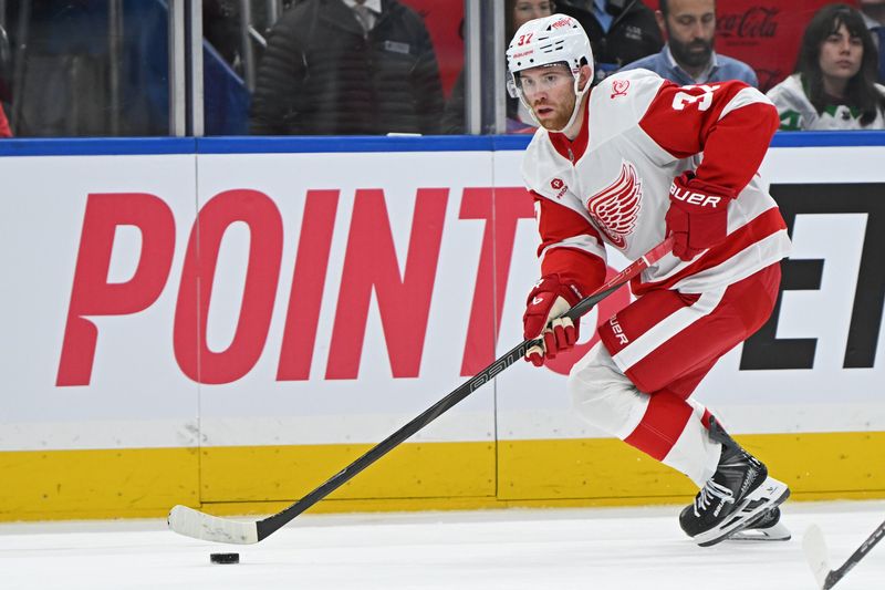 Oct 13, 2025; Toronto, Ontario, CAN; Detroit Red Wings left wing J.T. Compher (37) controls the puck in the third period against the Toronto Maple Leafs at Scotiabank Arena. Mandatory Credit: Gerry Angus-Imagn Images