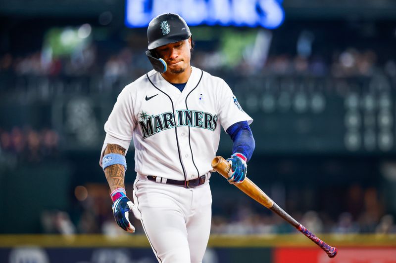 Jun 18, 2023; Seattle, Washington, USA; Seattle Mariners second baseman Kolten Wong (16) reacts after striking out against the Chicago White Sox during the third inning at T-Mobile Park. Mandatory Credit: Joe Nicholson-USA TODAY Sports