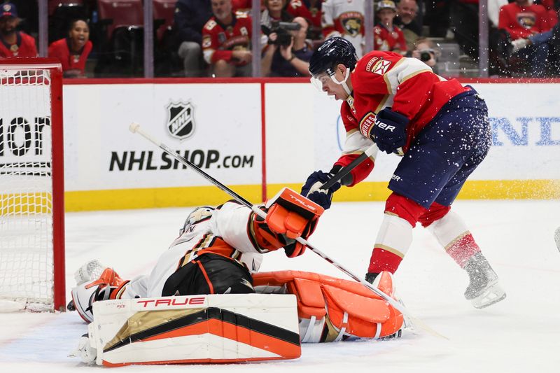 Jan 15, 2024; Sunrise, Florida, USA; Florida Panthers center Evan Rodrigues (17) shoots as Anaheim Ducks goaltender John Gibson (36) makes a save during the second period at Amerant Bank Arena. Mandatory Credit: Sam Navarro-USA TODAY Sports