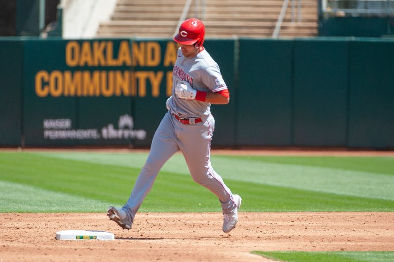 Apr 29, 2023; Oakland, California, USA; Cincinnati Reds catcher Luke Maile (22) rounds the bases after hitting a home run during the third inning against the Oakland Athletics at RingCentral Coliseum. Mandatory Credit: Ed Szczepanski-USA TODAY Sports