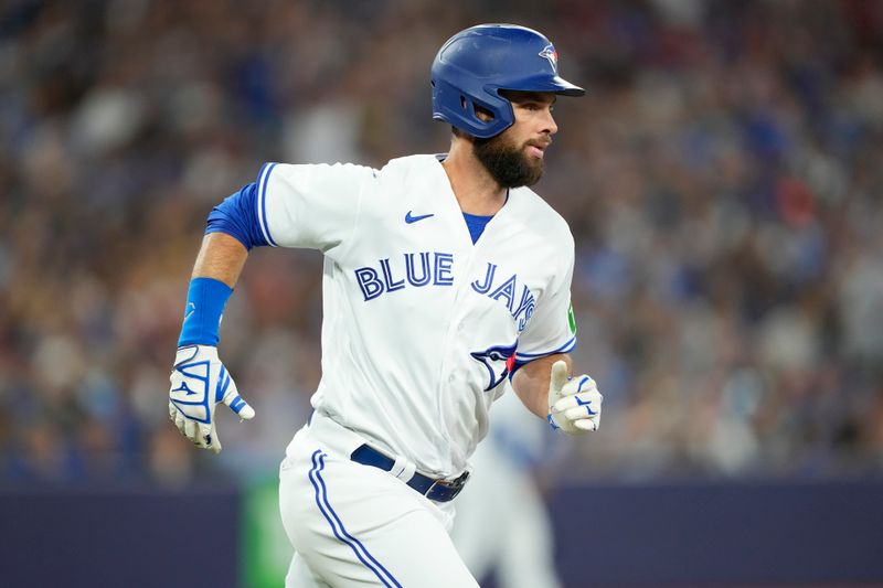 Jul 19, 2023; Toronto, Ontario, CAN; Toronto Blue Jays first baseman Brandon Belt (13) runs to first base on a single against the San Diego Padres during the eighth inning at Rogers Centre. Mandatory Credit: John E. Sokolowski-USA TODAY Sports