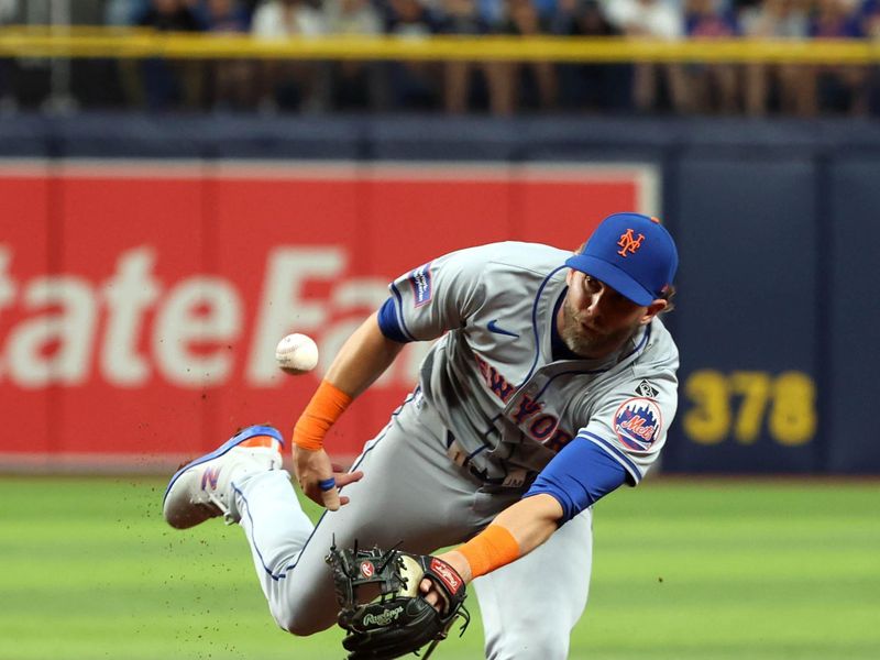 May 3, 2024; St. Petersburg, Florida, USA;  New York Mets second base Jeff McNeil (1) attempts to throw the ball to first base against the Tampa Bay Rays during the second inning at Tropicana Field. Mandatory Credit: Kim Klement Neitzel-USA TODAY Sports