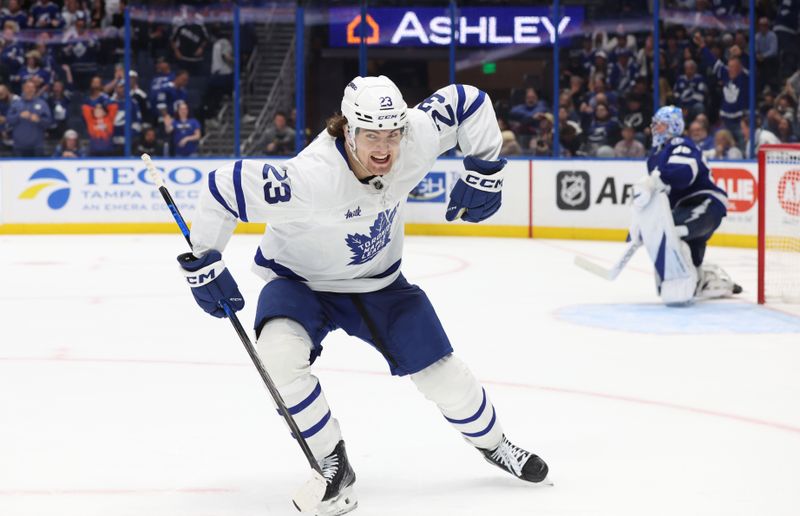 Apr 9, 2025; Tampa, Florida, USA; Toronto Maple Leafs left wing Matthew Knies (23) celebrates after scoring the winning goal against the Tampa Bay Lightning during overtime at Amalie Arena. Mandatory Credit: Kim Klement Neitzel-Imagn Images