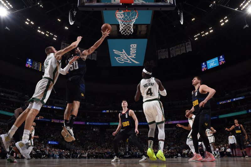 DENVER, CO - MARCH 7: Aaron Gordon #50 of the Denver Nuggets drives to the basket during the game against the Boston Celtics on March 7, 2024 at the Ball Arena in Denver, Colorado. NOTE TO USER: User expressly acknowledges and agrees that, by downloading and/or using this Photograph, user is consenting to the terms and conditions of the Getty Images License Agreement. Mandatory Copyright Notice: Copyright 2024 NBAE (Photo by Garrett Ellwood/NBAE via Getty Images)