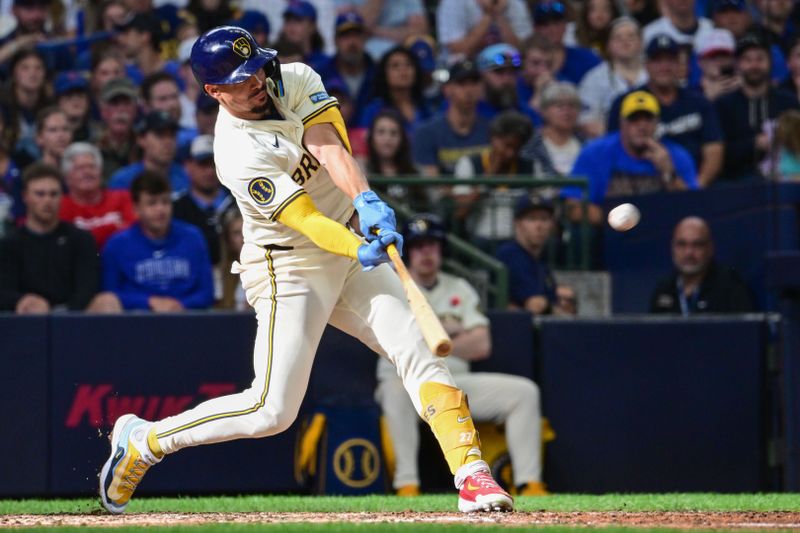 May 27, 2024; Milwaukee, Wisconsin, USA; Milwaukee Brewers shortstop Willy Adames (27) hits a 3-run home run in the eighth inning against the Chicago Cubs at American Family Field. Mandatory Credit: Benny Sieu-USA TODAY Sports