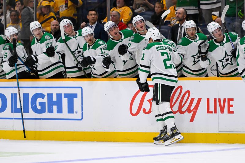 Oct 10, 2024; Nashville, Tennessee, USA;  Dallas Stars left wing Jason Robertson (21) celebrates his goal with his teammates against the Nashville Predators during the second period at Bridgestone Arena. Mandatory Credit: Steve Roberts-Imagn Images