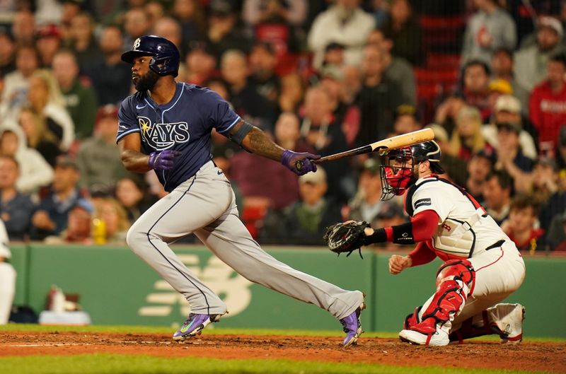 May 13, 2024; Boston, Massachusetts, USA; Tampa Bay Rays left fielder Randy Arozarena (56) gets a base hit against the Boston Red Sox in the seventh inning at Fenway Park. Mandatory Credit: David Butler II-USA TODAY Sports