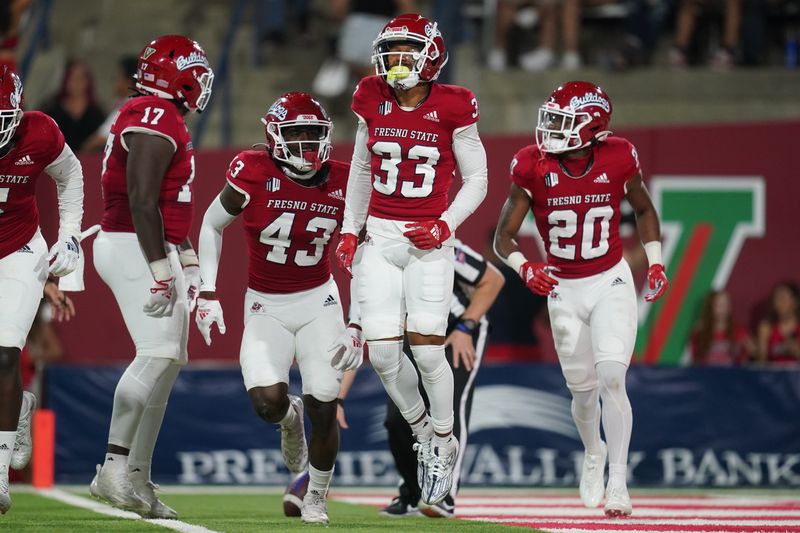 Oct 15, 2022; Fresno, California, USA; Fresno State Bulldogs defensive back Bralyn Lux (33) reacts after intercepting a pass against the San Jose State Spartans in the first quarter at Valley Children's Stadium. Mandatory Credit: Cary Edmondson-USA TODAY Sports