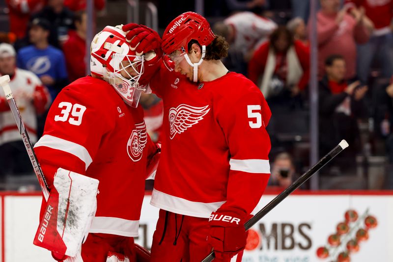 Jan 25, 2025; Detroit, Michigan, USA;  Detroit Red Wings goaltender Cam Talbot (39) and defenseman Moritz Seider (53) celebrate after defeating the Tampa Bay Lightning at Little Caesars Arena. Mandatory Credit: Rick Osentoski-Imagn Images