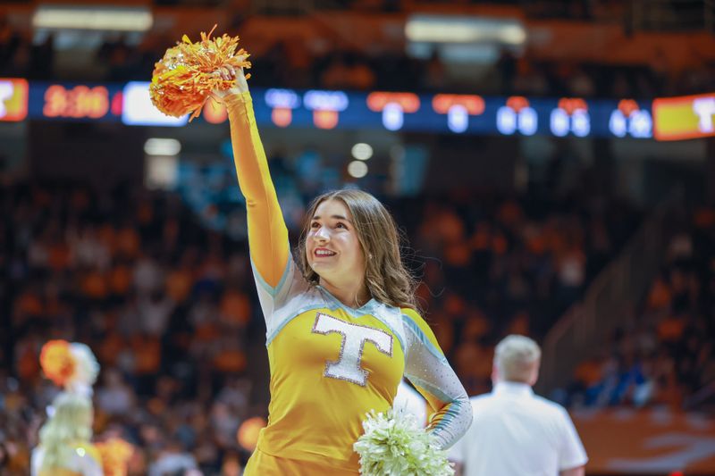 Nov 30, 2022; Knoxville, Tennessee, USA; A Tennessee Volunteers cheerleader performs during the game against the McNeese State Cowboys at Thompson-Boling Arena. Mandatory Credit: Randy Sartin-USA TODAY Sports