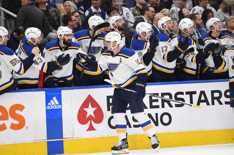 Jan 3, 2023; Toronto, Ontario, CAN; St. Louis Blues forward Brayden Schenn (10) celebrates at the bench with teammates after scoring against the Toronto Maple Leafs in the first period at Scotiabank Arena. Mandatory Credit: Dan Hamilton-USA TODAY Sports