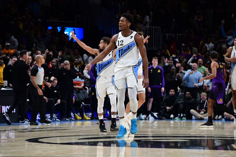 ATLANTA, GA - DECEMBER 6: De'Andre Hunter #12 of the Atlanta Hawks celebrates during the game against the Los Angeles Lakers on December 6, 2024 at State Farm Arena in Atlanta, Georgia.  NOTE TO USER: User expressly acknowledges and agrees that, by downloading and/or using this Photograph, user is consenting to the terms and conditions of the Getty Images License Agreement. Mandatory Copyright Notice: Copyright 2024 NBAE (Photo by Scott Cunningham/NBAE via Getty Images)