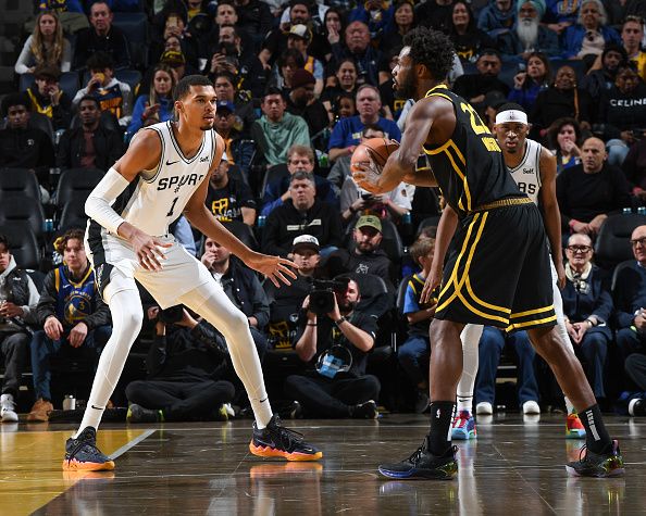 SAN FRANCISCO, CA - NOVEMBER 24:  Victor Wembanyama #1 of the San Antonio Spurs plays defense during the game  against Andrew Wiggins #22 of the Golden State Warriors during the in-Season Tournament on November 24, 2023 at Chase Center in San Francisco, California. NOTE TO USER: User expressly acknowledges and agrees that, by downloading and or using this photograph, user is consenting to the terms and conditions of Getty Images License Agreement. Mandatory Copyright Notice: Copyright 2023 NBAE (Photo by Noah Graham/NBAE via Getty Images)