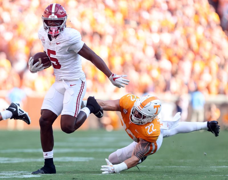 Oct 19, 2024; Knoxville, Tennessee, USA; Alabama Crimson Tide wide receiver  Germie Bernard (5) runs the ball against Tennessee Volunteers linebacker Jeremiah Telander (22) during the second quarter at Neyland Stadium. Mandatory Credit: Alan Poizner-Imagn Images