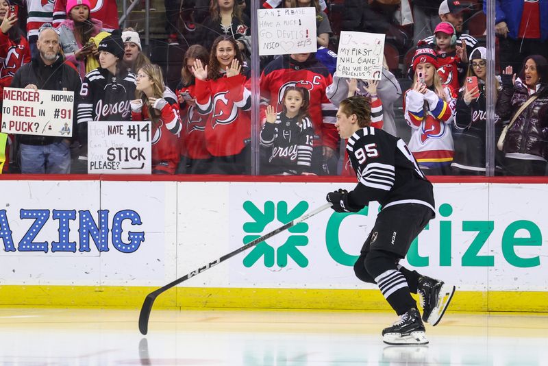 Jan 6, 2024; Newark, New Jersey, USA; New Jersey Devils right wing Graeme Clarke (95) takes his rookie lap before the start of warmups for their game against the Vancouver Canucks at Prudential Center. Mandatory Credit: Ed Mulholland-USA TODAY Sports