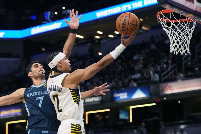 INDIANAPOLIS, INDIANA - OCTOBER 14: Andrew Nembhard #2 of the Indiana Pacers lays up a shot against Santi Aldama #7 of the Memphis Grizzlies in the first quarter during a preseason game at Gainbridge Fieldhouse on October 14, 2024 in Indianapolis, Indiana. NOTE TO USER: User expressly acknowledges and agrees that, by downloading and or using this photograph, User is consenting to the terms and conditions of the Getty Images License Agreement. (Photo by Dylan Buell/Getty Images)