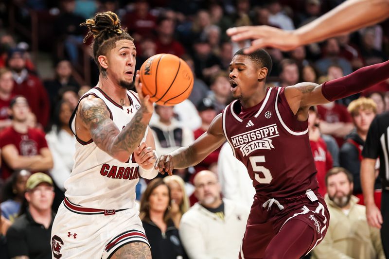 Jan 6, 2024; Columbia, South Carolina, USA; South Carolina Gamecocks guard Myles Stute (10) passes around Mississippi State Bulldogs guard Shawn Jones Jr. (5) in the first half at Colonial Life Arena. Mandatory Credit: Jeff Blake-USA TODAY Sports