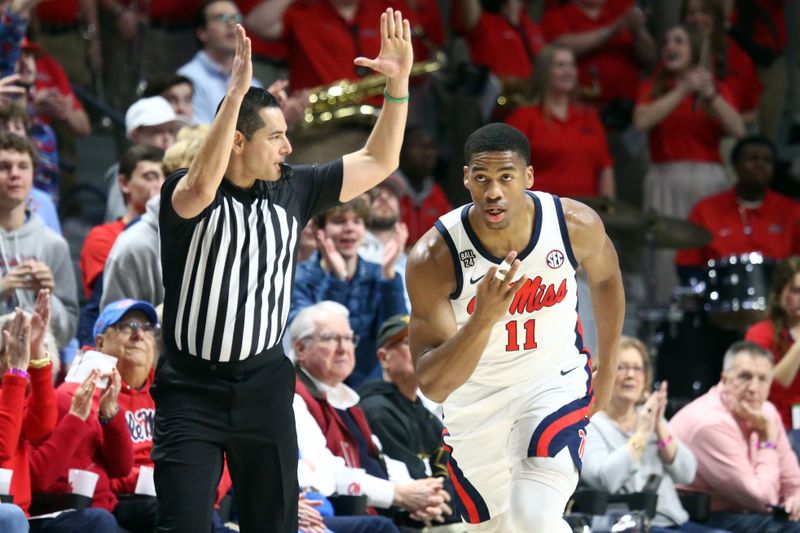 Jan 13, 2024; Oxford, Mississippi, USA; Mississippi Rebels guard Matthew Murrell (11) reacts after a three point basket against the Vanderbilt Commodores during the first half at The Sandy and John Black Pavilion at Ole Miss. Mandatory Credit: Petre Thomas-USA TODAY Sports