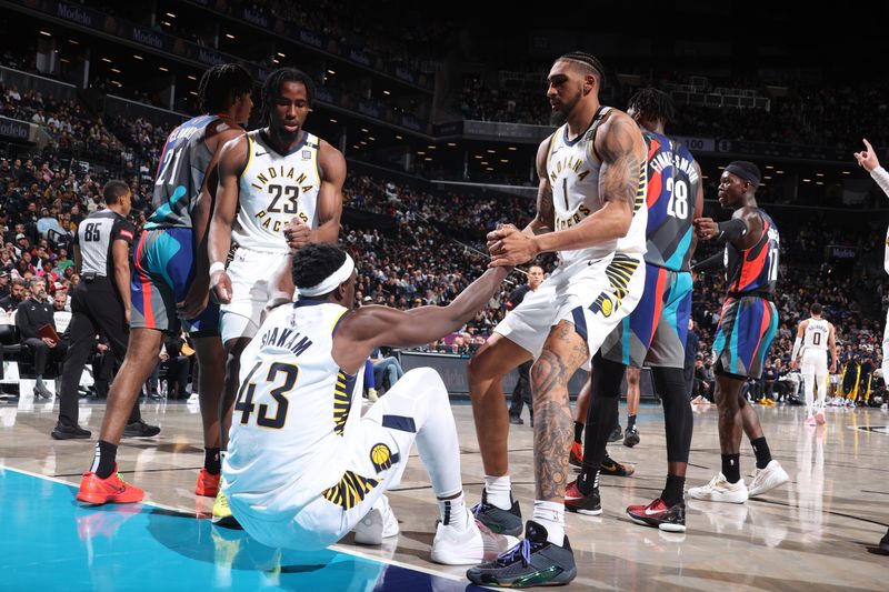 BROOKLYN, NY - APRIL 3: Aaron Nesmith #23 and Obi Toppin #1 help up Pascal Siakam #43 of the Indiana Pacers during the game against the Brooklyn Nets on April 3, 2024 at Barclays Center in Brooklyn, New York. NOTE TO USER: User expressly acknowledges and agrees that, by downloading and or using this Photograph, user is consenting to the terms and conditions of the Getty Images License Agreement. Mandatory Copyright Notice: Copyright 2024 NBAE (Photo by Nathaniel S. Butler/NBAE via Getty Images)