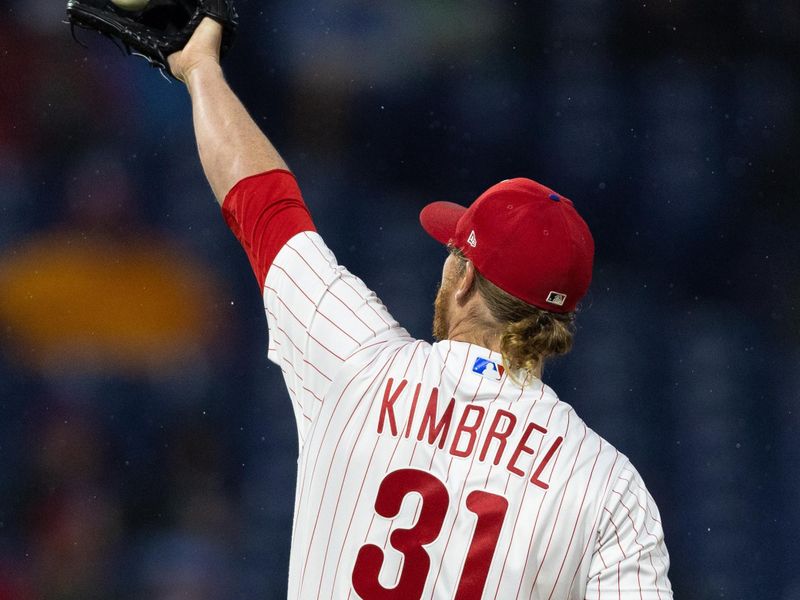 Apr 26, 2023; Philadelphia, Pennsylvania, USA; Philadelphia Phillies relief pitcher Craig Kimbrel (31) catches the ball to pitch against the Seattle Mariners during the eighth inning at Citizens Bank Park. Mandatory Credit: Bill Streicher-USA TODAY Sports