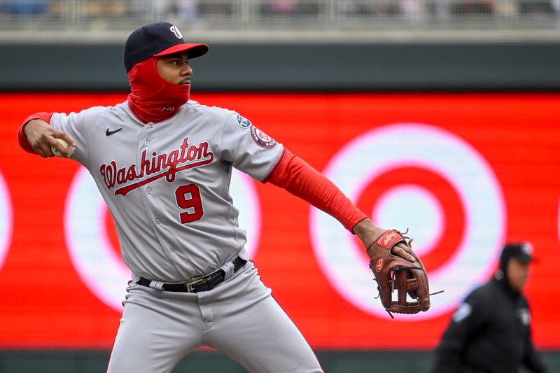 Apr 23, 2023; Minneapolis, Minnesota, USA;  Washington Nationals infielder Jeimer Candelario (9) throws to first against the Minnesota Twins at Target Field. Mandatory Credit: Nick Wosika-USA TODAY Sports