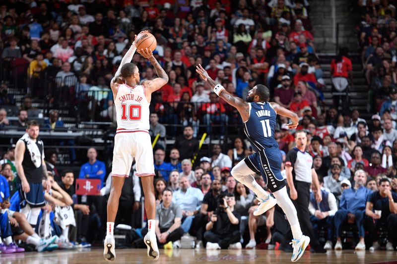 HOUSTON, TX - MARCH 31: Jabari Smith Jr. #10 of the Houston Rockets shoots the ball during the game against the Dallas Mavericks on March 31, 2024 at the Toyota Center in Houston, Texas. NOTE TO USER: User expressly acknowledges and agrees that, by downloading and or using this photograph, User is consenting to the terms and conditions of the Getty Images License Agreement. Mandatory Copyright Notice: Copyright 2024 NBAE (Photo by Logan Riely/NBAE via Getty Images)