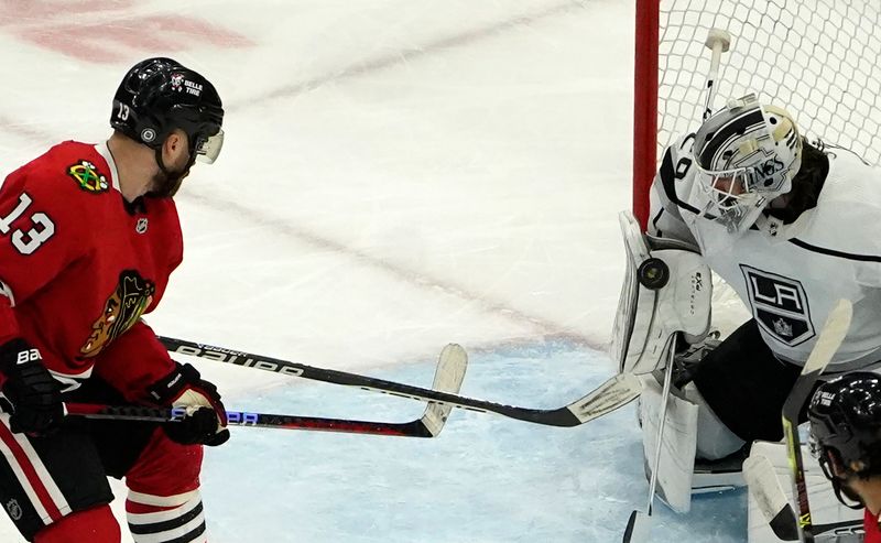 Jan 22, 2023; Chicago, Illinois, USA; Chicago Blackhawks center Max Domi (13) shoots the puck as Los Angeles Kings goaltender Pheonix Copley (29) makes a save during the second period at United Center. Mandatory Credit: David Banks-USA TODAY Sports