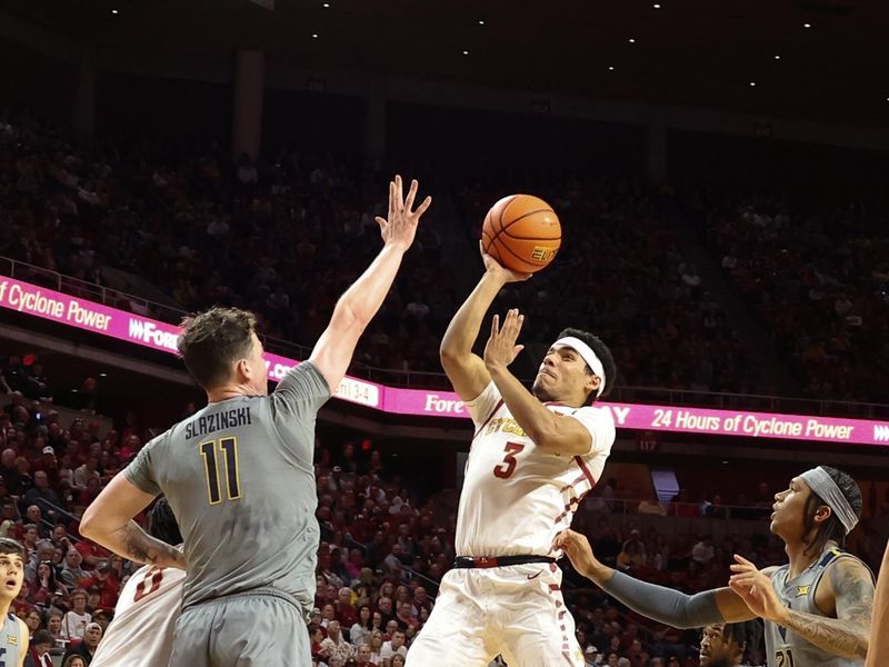 Feb 24, 2024; Ames, Iowa, USA;  West Virginia Mountaineers forward Quinn Slazinski (11) defends the shot from Iowa State Cyclones guard Tamin Lipsey (3) during the first half at James H. Hilton Coliseum. Mandatory Credit: Reese Strickland-USA TODAY Sports