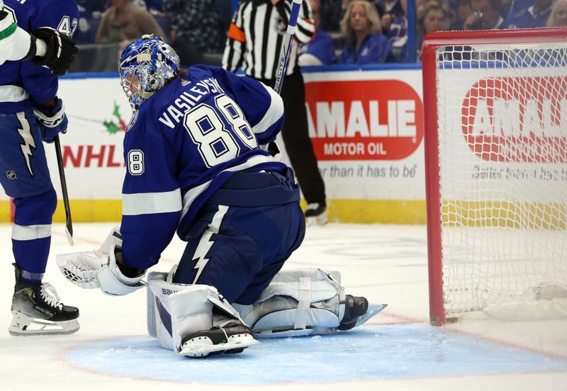 Dec 4, 2023; Tampa, Florida, USA; Tampa Bay Lightning goaltender Andrei Vasilevskiy (88) makes a save against the Dallas Stars during the second period at Amalie Arena. Mandatory Credit: Kim Klement Neitzel-USA TODAY Sports